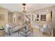 Open-concept living space featuring arched doorways, modern furniture, and a seamless flow at 7410 S Fitzgerald St, Tampa, FL 33616