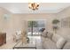 Bright living room with sliding glass doors to outdoor patio, offering seamless indoor-outdoor living at 7410 S Fitzgerald St, Tampa, FL 33616