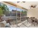 Screened patio with outdoor seating and views of backyard landscaping and adjacent home at 7410 S Fitzgerald St, Tampa, FL 33616
