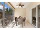 Screened patio with dining table and chairs for comfortable outdoor living at 7410 S Fitzgerald St, Tampa, FL 33616