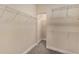 Empty walk-in closet with white wire shelving; ready to customize and organize at 7410 S Fitzgerald St, Tampa, FL 33616
