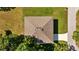A bird's eye view shows a home's roof, back yard, driveway, and neighborhood at 7603 Rhode Island Dr, Tampa, FL 33619