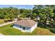Aerial view showcases lush backyard, mature trees in a desirable neighborhood at 7603 Rhode Island Dr, Tampa, FL 33619
