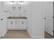 Elegant bathroom featuring double sinks, granite counters, and modern fixtures at 7603 Rhode Island Dr, Tampa, FL 33619