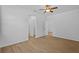 Bright bedroom featuring sleek wood-look floors and ample natural light at 7603 Rhode Island Dr, Tampa, FL 33619