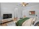 Well-lit bedroom with stylish decor and wood-look floors offers a relaxing retreat at 7603 Rhode Island Dr, Tampa, FL 33619