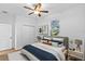 Bedroom featuring a ceiling fan, closet and a comfortable bed with decorative pillows at 7603 Rhode Island Dr, Tampa, FL 33619