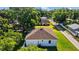 Single-story home with light colored paint, attached garage, and an ample lawn at 7603 Rhode Island Dr, Tampa, FL 33619