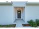 A charming front entrance with a decorative chandelier creates a welcoming first impression at 7603 Rhode Island Dr, Tampa, FL 33619