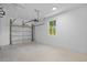 Clean garage interior with door and window at 7603 Rhode Island Dr, Tampa, FL 33619