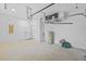 Garage interior with door to the house, utility, and storage at 7603 Rhode Island Dr, Tampa, FL 33619