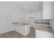 Kitchen with granite countertops, stainless steel sink and modern pendant lighting at 7603 Rhode Island Dr, Tampa, FL 33619
