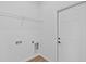 Well-lit laundry room featuring updated flooring, ample room for laundry appliances and plenty of space at 7603 Rhode Island Dr, Tampa, FL 33619