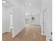 Bright and open living room featuring modern flooring, neutral paint, and a ceiling fan at 7603 Rhode Island Dr, Tampa, FL 33619