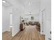 Bright living room with wood floors flows into the dining area with sliding glass door at 7603 Rhode Island Dr, Tampa, FL 33619