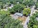 This aerial view captures the home's setting among mature trees, street access, and neighborhood charm at 8114 N 11Th St, Tampa, FL 33604