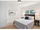 Bedroom featuring a comfortable bed, natural light, and neutral decor at 8114 N 11Th St, Tampa, FL 33604
