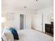 Bedroom with light wood floors, closet, and modern decor at 8114 N 11Th St, Tampa, FL 33604
