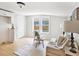 Inviting living room with natural light, neutral decor, and a cozy seating area at 8114 N 11Th St, Tampa, FL 33604