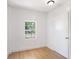 Small room with light-colored walls, and light wood-look floors at 8114 N 11Th St, Tampa, FL 33604