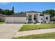 Charming single-story home featuring a 3-car garage and well-maintained landscaping at 8406 Glengarry Pl, Trinity, FL 34655