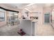 Open kitchen layout with an island and breakfast bar adjacent to a dining area at 8406 Glengarry Pl, Trinity, FL 34655