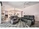 Bright living room featuring tile floors and an open view to the kitchen and dining area at 8406 Glengarry Pl, Trinity, FL 34655