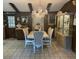 Formal dining area with a crystal chandelier, decorative display cabinet, and seating for eight at 9481 Patrick St, Brooksville, FL 34601