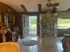 Dining room with a decorative display cabinet, adjacent to a door leading to the outside at 9481 Patrick St, Brooksville, FL 34601