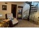 Cozy living area with comfortable seating, a spiral staircase, and stylish décor at 9481 Patrick St, Brooksville, FL 34601