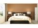 Cozy bedroom features a king-sized bed and large window at 10220 Trumpet Honeysuckle Way, San Antonio, FL 33576