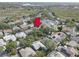 A beautiful aerial view of a neighborhood showcasing the well-maintained homes and established landscaping at 1069 Captains Way, Tarpon Springs, FL 34689