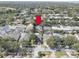 A lovely aerial view of a quiet neighborhood with mature trees, landscaping, and well-kept homes at 1069 Captains Way, Tarpon Springs, FL 34689