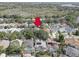 An aerial view of a neighborhood with lush greenery and mature trees in a desirable community at 1069 Captains Way, Tarpon Springs, FL 34689