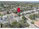 Aerial view featuring a home with mature landscaping in a well-maintained, desirable neighborhood at 1069 Captains Way, Tarpon Springs, FL 34689