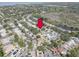 See this beautiful home from above with gorgeous mature trees and nearby lake in a great community at 1069 Captains Way, Tarpon Springs, FL 34689