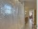 Bathroom with marble floors and a decorative shower curtain at 1069 Captains Way, Tarpon Springs, FL 34689