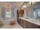 Elegant bathroom with soaking tub, modern vanities, and stylish fixtures at 1069 Captains Way, Tarpon Springs, FL 34689