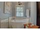 Stylish bathroom featuring a standalone tub, modern fixtures, and soft, natural lighting at 1069 Captains Way, Tarpon Springs, FL 34689