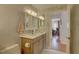 Bathroom featuring modern fixtures, a white countertop and a decorative mirror at 1069 Captains Way, Tarpon Springs, FL 34689