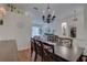 Elegant dining room with dark wood table, chandelier and decor at 1069 Captains Way, Tarpon Springs, FL 34689