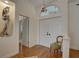 Bright foyer featuring hardwood floors, elegant lighting, and a view into adjoining rooms at 1069 Captains Way, Tarpon Springs, FL 34689