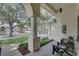 Inviting front porch with comfortable seating and charming curb appeal at 1069 Captains Way, Tarpon Springs, FL 34689