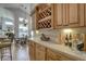 Bright kitchen with custom cabinets, tile backsplash and a wine rack at 1069 Captains Way, Tarpon Springs, FL 34689