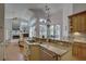 Bright kitchen with granite countertops and stainless steel appliances at 1069 Captains Way, Tarpon Springs, FL 34689