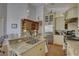 Bright kitchen with custom cabinets, granite countertops and stainless steel appliances at 1069 Captains Way, Tarpon Springs, FL 34689