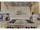 Close-up of stainless steel gas stovetop in a bright and upgraded kitchen at 1069 Captains Way, Tarpon Springs, FL 34689