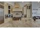 Gourmet kitchen features custom cabinetry, granite countertops and stainless steel appliances at 1069 Captains Way, Tarpon Springs, FL 34689
