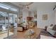 Open living space with hardwood floors and view of the screened outdoor lanai at 1069 Captains Way, Tarpon Springs, FL 34689