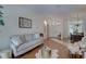 Cozy living room with hardwood floors, comfortable seating, and stylish decor at 1069 Captains Way, Tarpon Springs, FL 34689